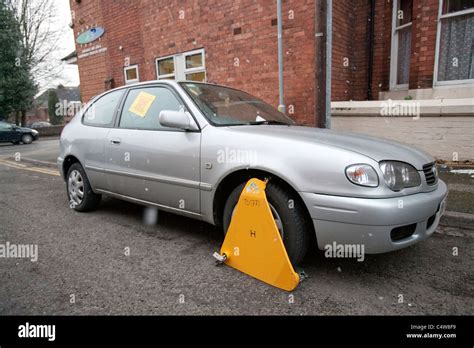 Untaxed Car Clamped By The Dvla Untaxed Vehicle Wheel Clamped Stock