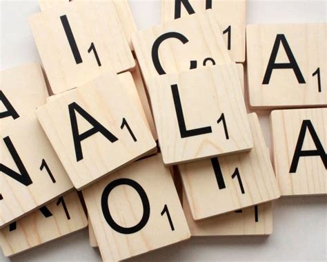 Scrabble Tiles Spelling Out Words That Spell Out The Names Of Each Letter In Black And White