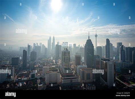 Cityscape Of Kuala Lumpur City Skyline On Blue Sky With Sunlight In