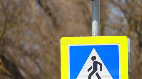 Pedestrian Crossing Road Sign Close Up At Midday Square Blue Sign With