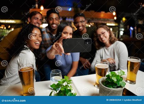 Young Multiracial Group Of Friends In Casual Clothing Smiling While