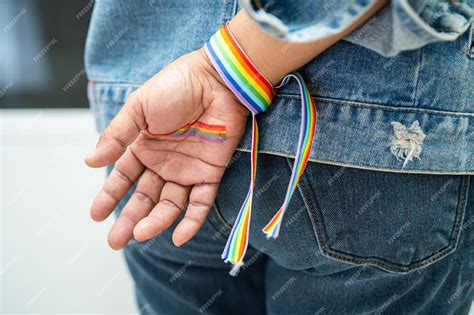 Premium Photo Asian Lady Wearing Rainbow Flag Wristbands Symbol Of