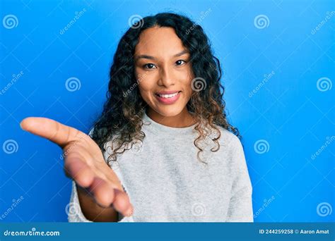 Young Latin Woman Wearing Casual Clothes Smiling Friendly Offering