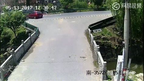 An Overloaded Three Wheeler Loses Control While Turning And Crashes Into The Side Of A Bridge