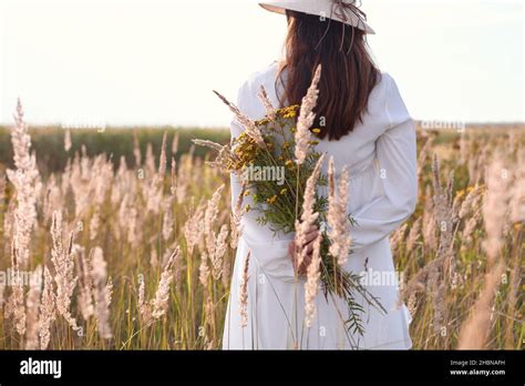 Woman Gathering Herbs In Garden Hi Res Stock Photography And Images Alamy