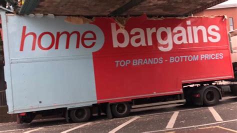 Home Bargains Lorry Wedged Under Railway Bridge With Roof Ripped Off As