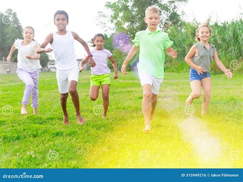 Barefoot Kids Running On Green Grass Stock Photo Image Of Cameroonian