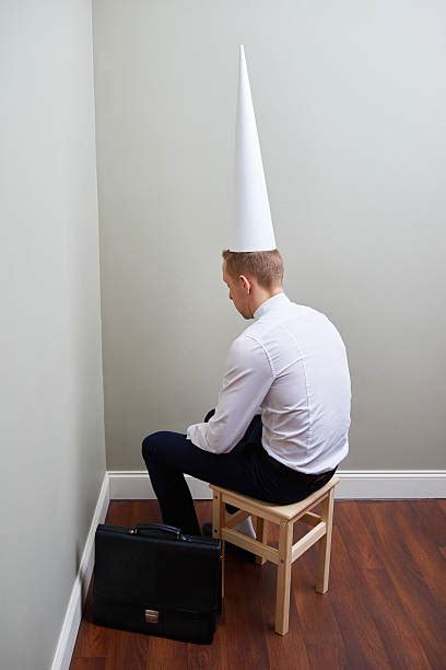 10 Businessman Sat In Corner With Dunce Cap Stock Photos Pictures