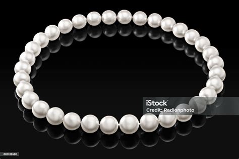 Luxury White Pearl Necklace On A Black Background With Glossy