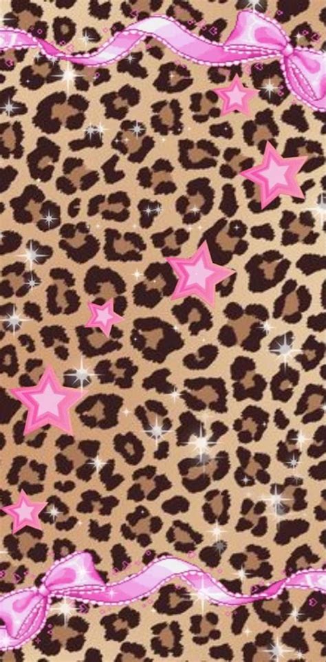 A Leopard Print With Pink Stars And Ribbon On The Side In Front Of A