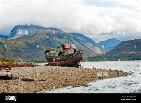 The Old Fishing Boat On The Shingled Shoreline Of Loch Linnhe Near Fort