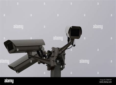 Close up view on three industrial security CCTV cameras installed on ...