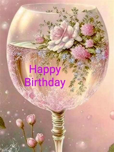 A Happy Birthday Card With An Image Of A Wine Glass Filled With Flowers