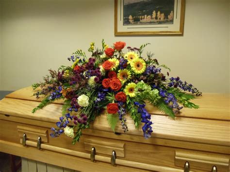 Gorgeous Casket Spray With Roses Delphinium Daisies Heather And