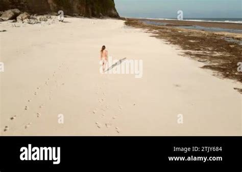 Naked Woman Walking And Sunbathing At Sandy Beach Near Ocean Aerial View Stock Video Footage