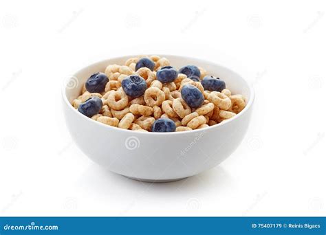 Bowl Of Whole Grain Cheerios Cereal With Blueberries Isolated On Stock