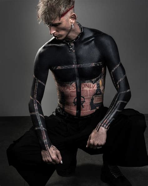 Machine Gun Kelly Shows Off Wild New Blackout Tattoos Covering His Arms