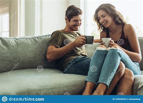 Couple Relaxing At Home With Coffee Stock Image Image Of Room