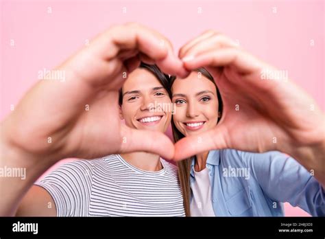 Photo Of Shiny Funny Young Couple Wear Casual Clothes Smiling Embracing Heart Cover Face