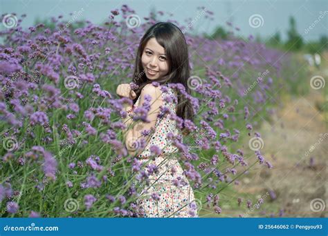 Young Girl Smiling in the Flowers Stock Photo - Image of skirt ...