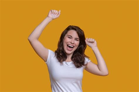 Free Photo | Smiling contented woman demonstrating her positive emotions