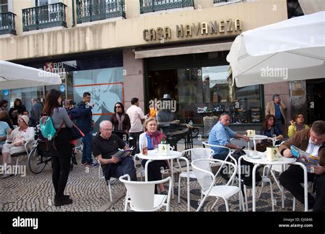 Cafes Along Paved Rua Garrett In Chiado Lisbon Portugal Stock Photo