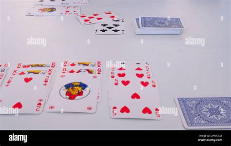 French cards on white table in game burraco Stock Photo - Alamy