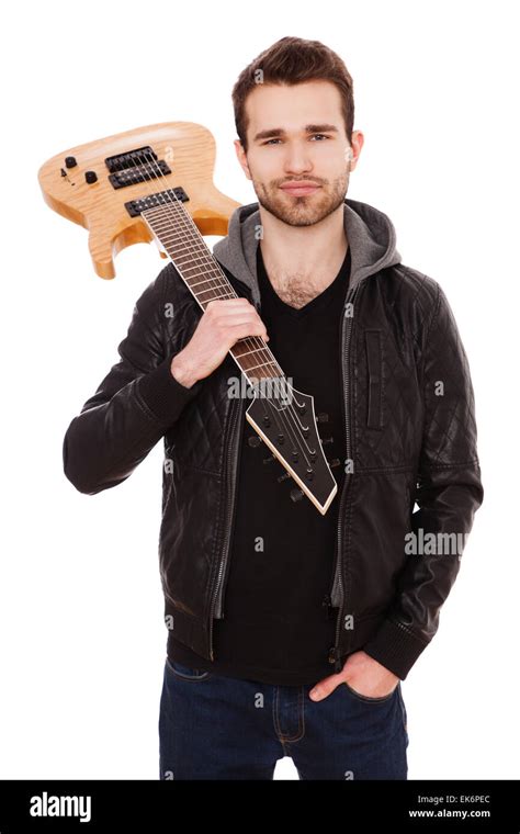 Handsome young man with an electric guitar Stock Photo - Alamy