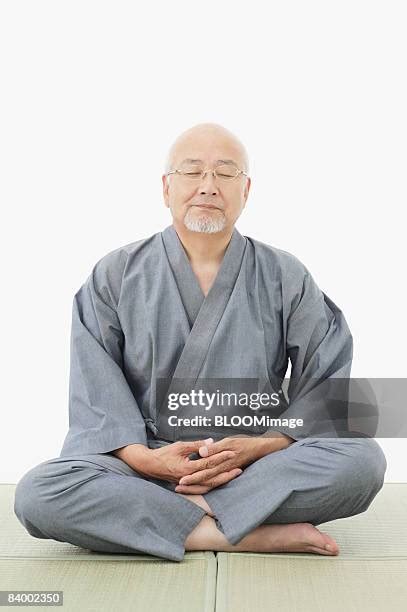 Man Eyes Closed Sitting Cross Legged Photos And Premium High Res