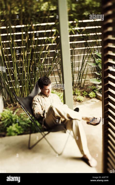 High Angle View Of A Mature Man Sitting On A Chair Stock Photo Alamy