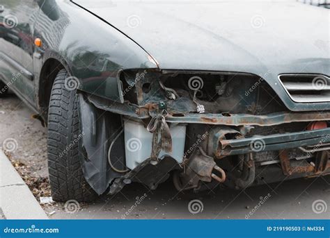 Broken Car Close Up No Front Bumper Headlight Rust On Metal Car