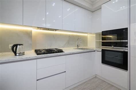 White Modern Kitchen with a Stove, Oven and Microwave, Stock Photo ...