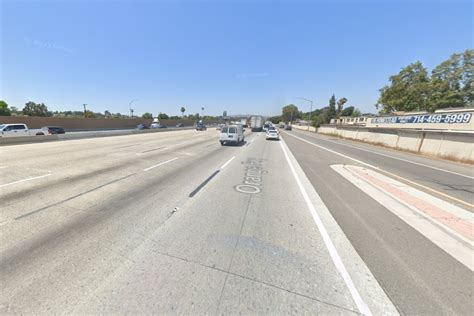 Big Rig Plunges Through Divider, Ignites Flames on 57 Freeway in