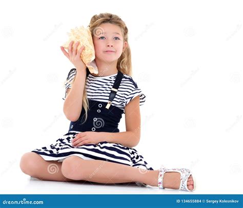 Little girl with sea shell stock photo. Image of lifestyle - 134655884