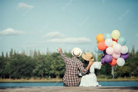 Free Photo Portrait Of A Couple In Love With Balloons Colorful