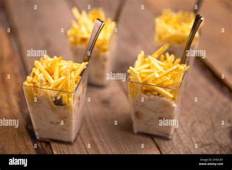 Creative Appetizer With Crispy French Fries Served In Clear Glass