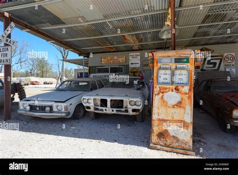 Rusty Old Fuel Pump And Vintage Cars Outside The Popular Outback Pub