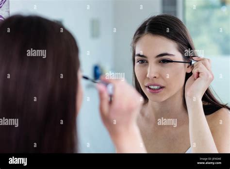 Brunette Applying Mascara Stock Photo Alamy