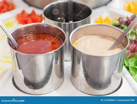 3 Containers Of Multiple Kinds Of Sauces Stock Photo Image Of Mustard