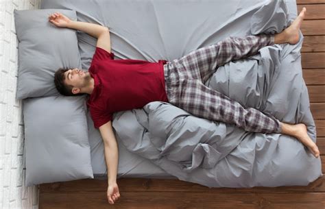 Premium Photo Handsome Peaceful Man Sleeping In Bed At Home Top View