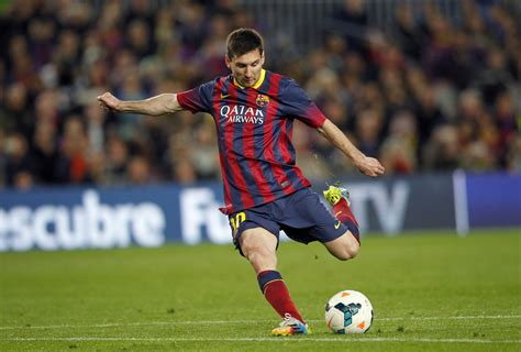 Download Lionel Messi Kicking A Ball Wallpaper | Wallpapers.com