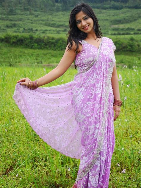 Mirchi Stills Nisha Shah Hot Navel Show In Saree