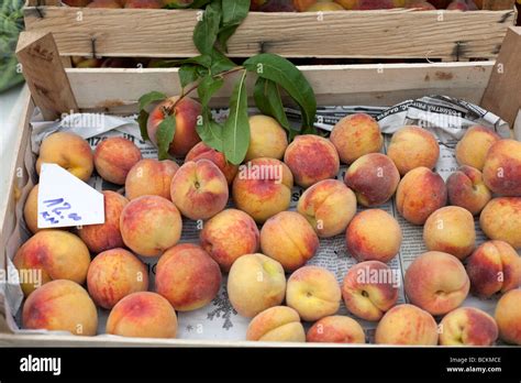 Naturally Grown Fruits Sold On The Market Peaches In A Wooden Crate