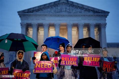 People Rally In The Rain To Show Support For The Biden News Photo