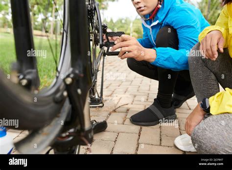 Man Checking If Bicycle Pedals Are Spinning Smoothly Stock Photo Alamy