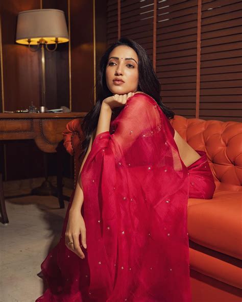 Neha Shetty Dazzles In A Transparent Red Saree And Reaches A Million