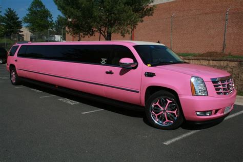 A Pink Limo Parked In A Parking Lot