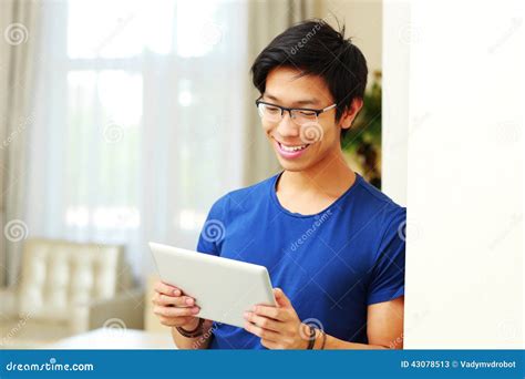 Happy Asian Man Using Tablet Computer Stock Image Image Of Living