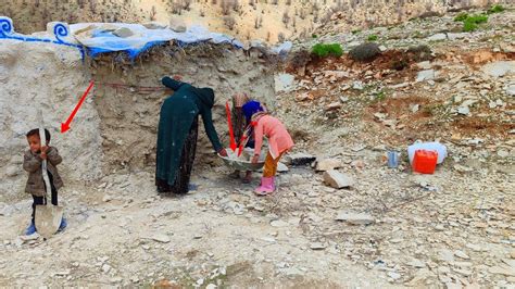 Plastering The Wall Of The Shelter By A Poor Nomadic Woman Who Is