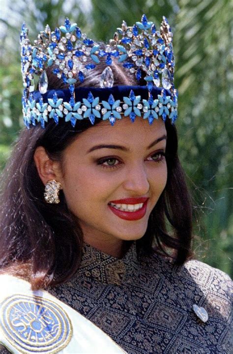 A Woman Wearing A Tiara And Smiling At The Camera